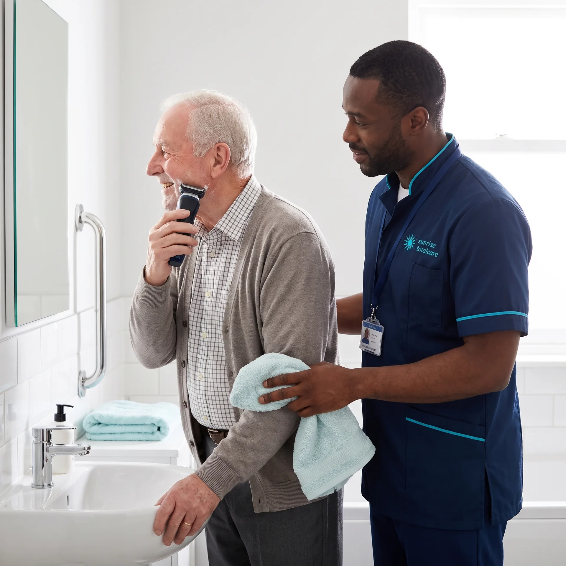 Older man shaving at his bathroom basin with a Sunrise Total Care carer beside him, supporting independent personal care